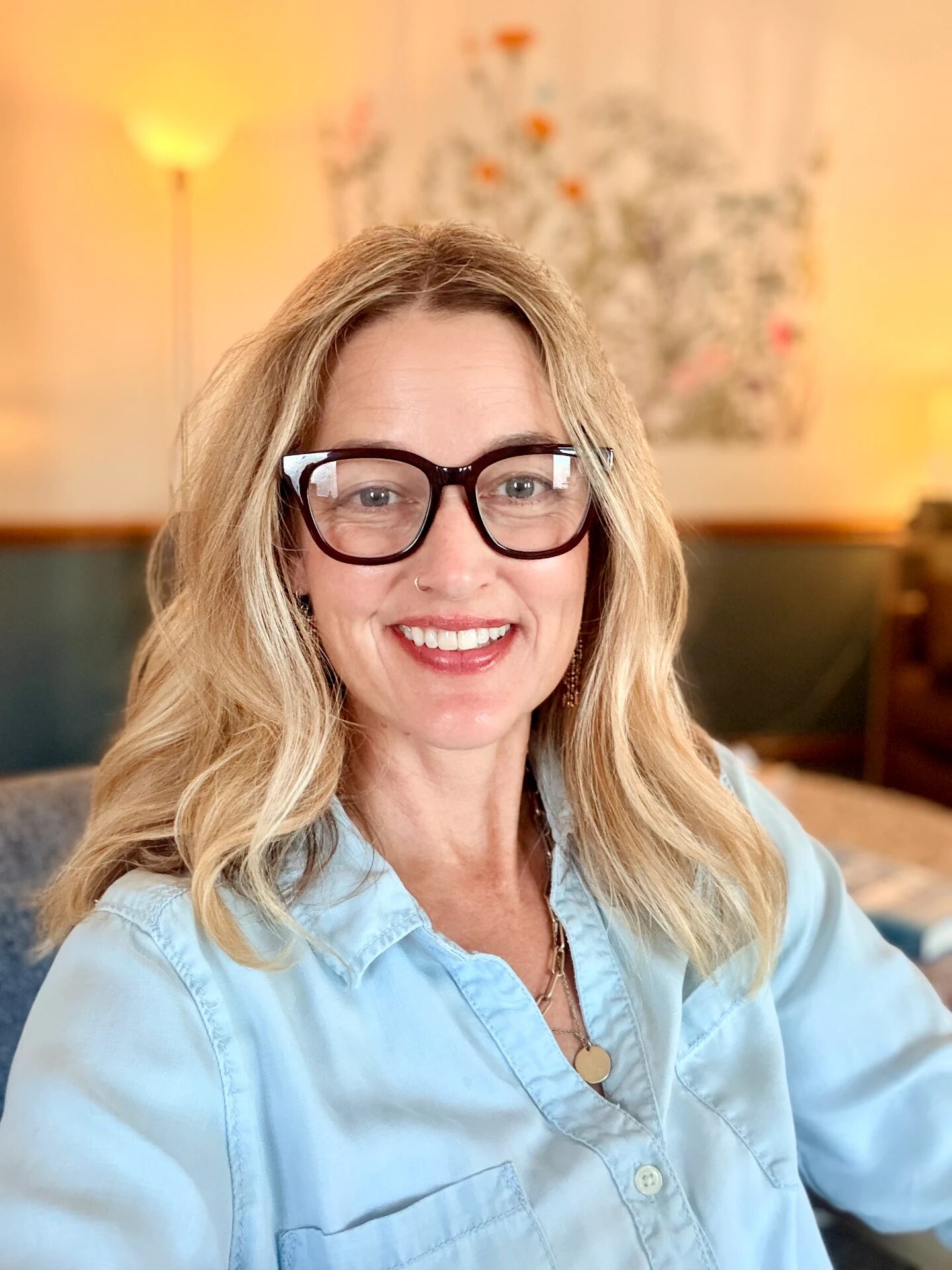 Portrait of Amy Pescaglia, LPC, MEd, E-RYT, smiling.